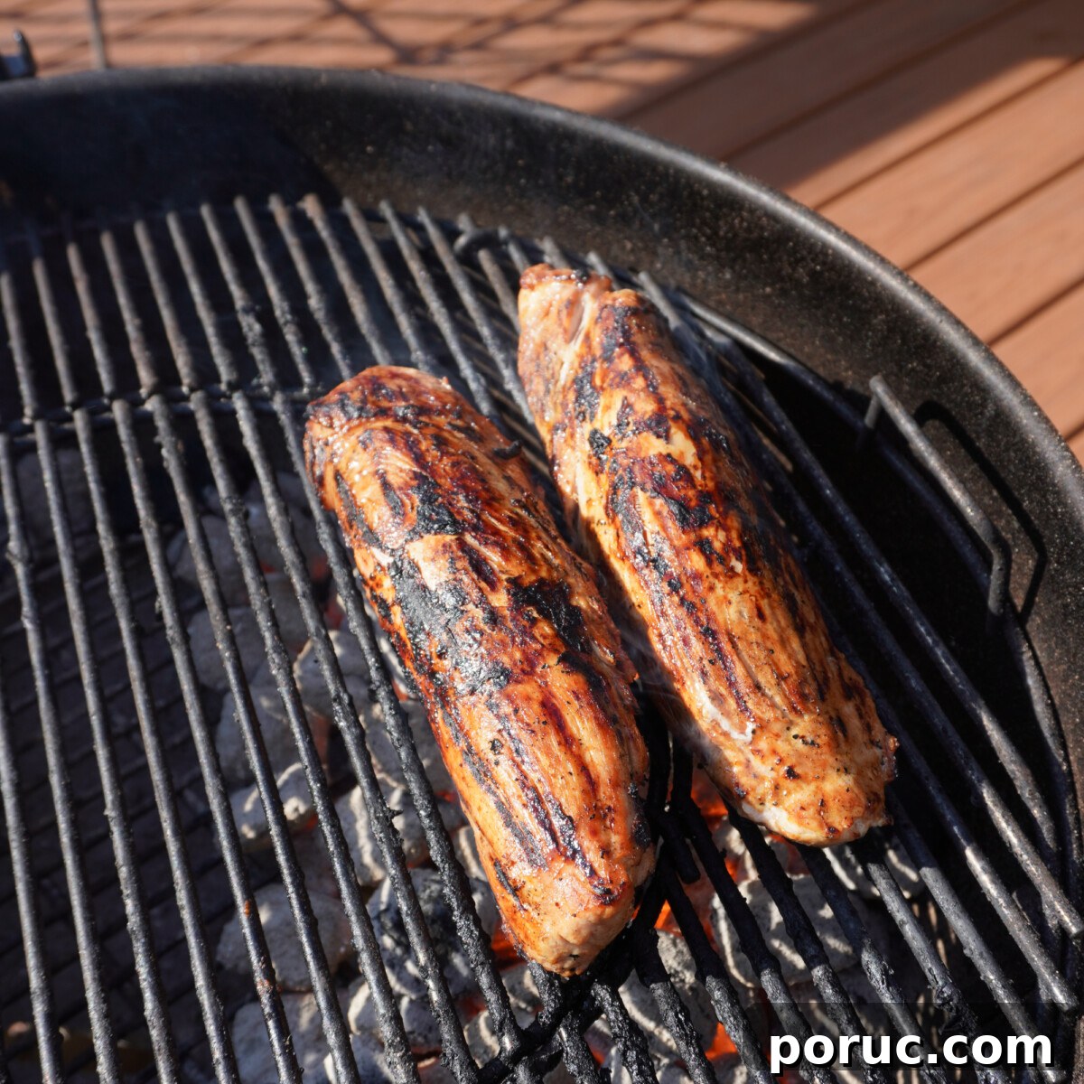 Sweet and Savory Pork Tenderloin Recipe with Glaze and Herbs 6 Grilled sweet and savory pork tenderloin over direct heat.