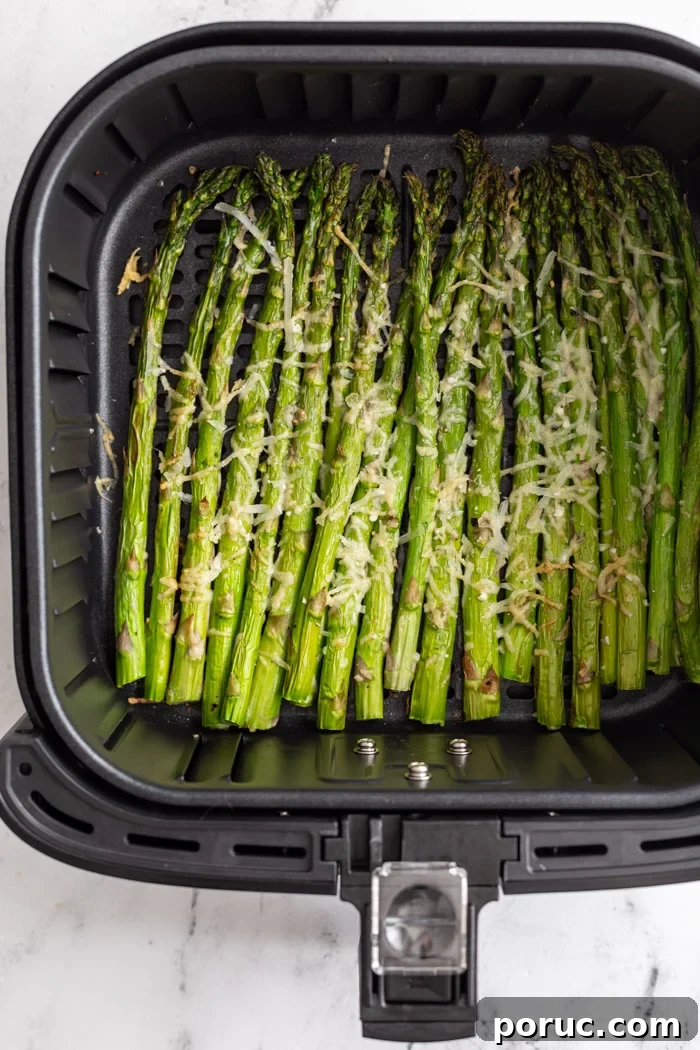 Crispy Air Fryer Asparagus Recipe — Quick Weeknight Side 2 asparagus air fryer cooked and topped with cheese