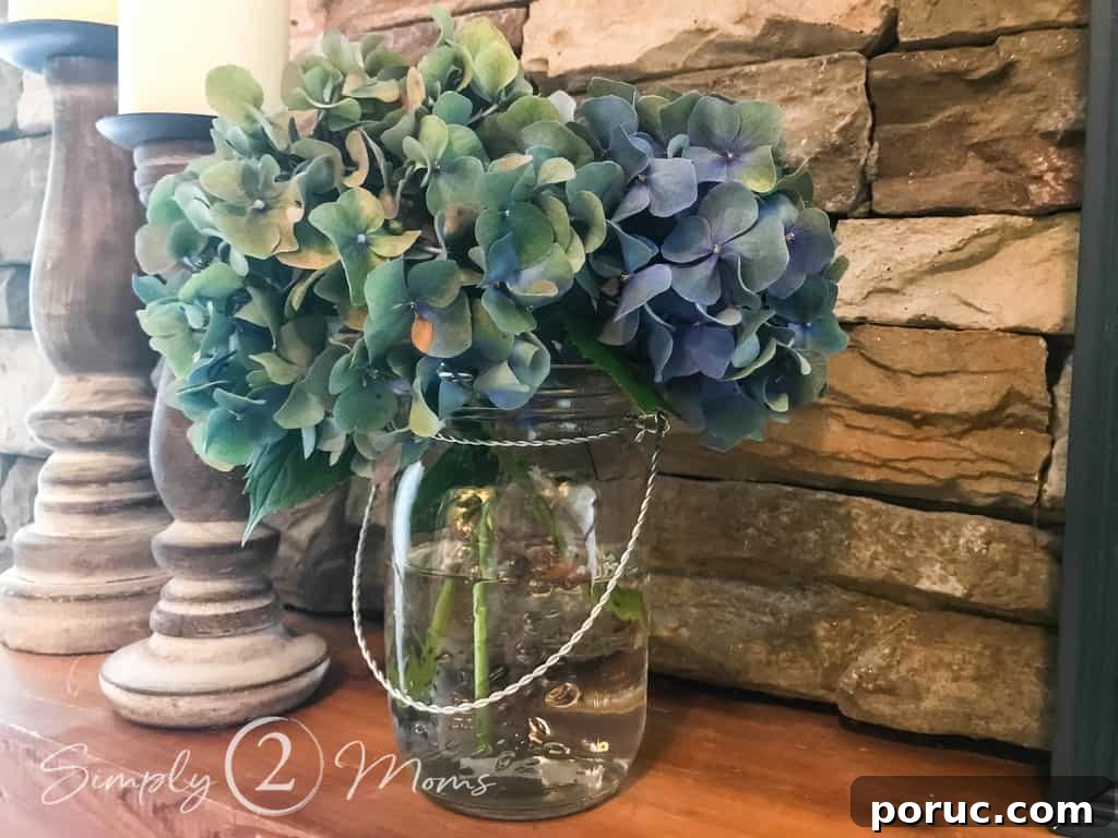 close up of mason jar vase filled with fresh hydrangea
