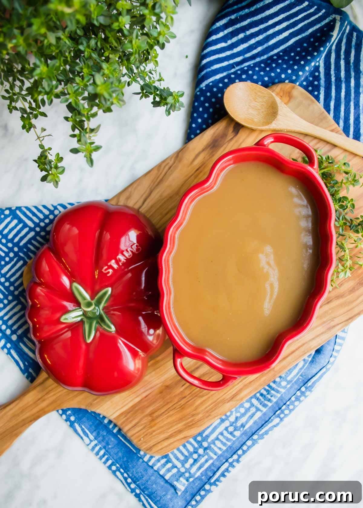 Turkey Au Jus Recipe — Savory Thin Gravy for Roast Turkey 2 Turkey Au Jus Gravy in staub tureen flatlay.