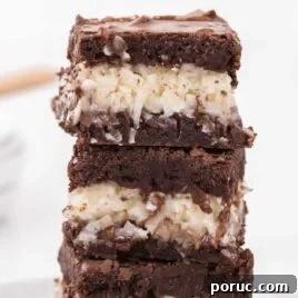 close up shot of Coconut Brownies stacked on top of each other
