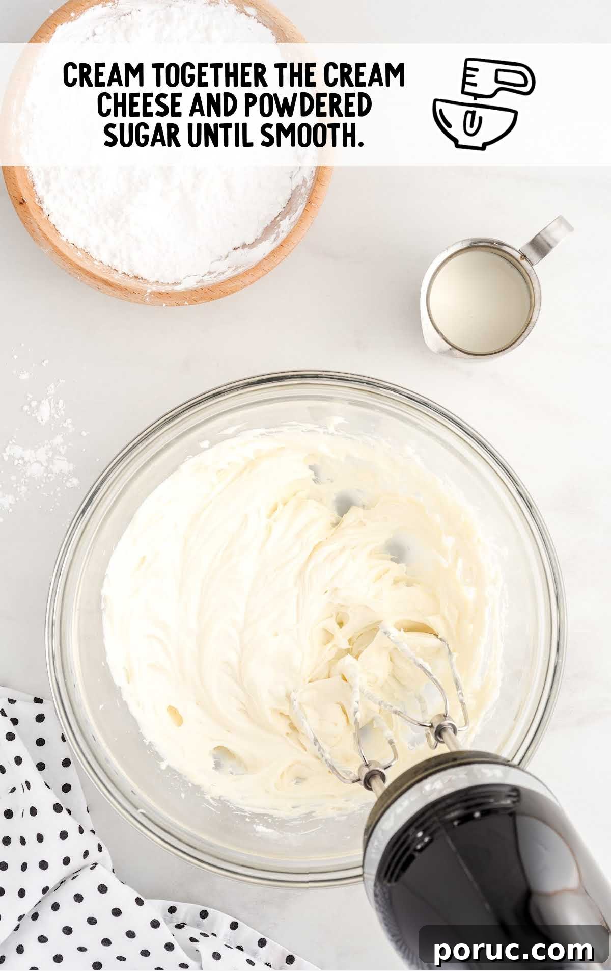 cream cheese and powdered sugar whisked together in a bowl
