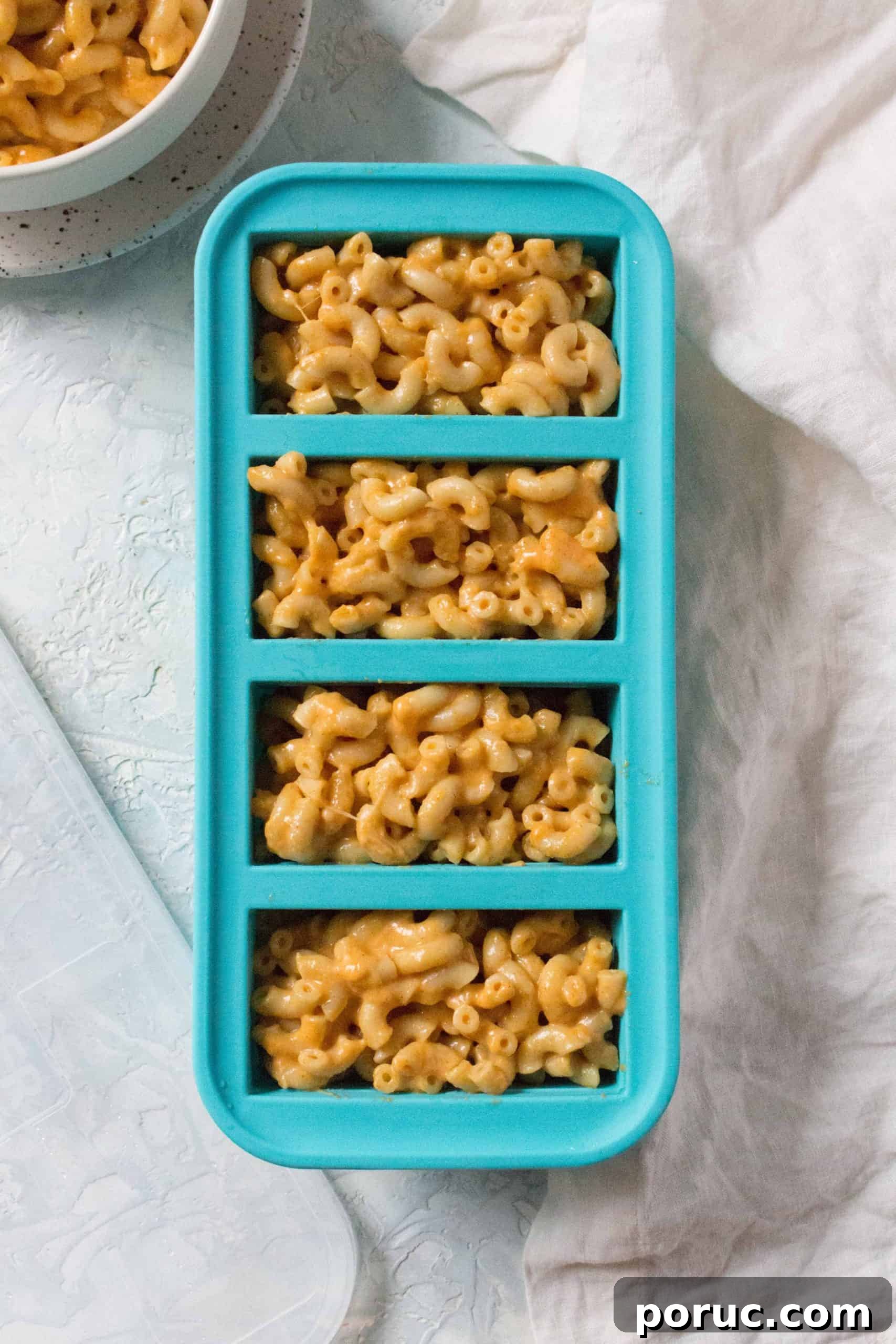 Creamy Instant Pot Macaroni and Cheese in 20 Minutes 6 A souper cube holding mac and cheese.