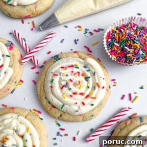 close up photo of crumble birthday cake cookies with sprinkles, candles, and frosting