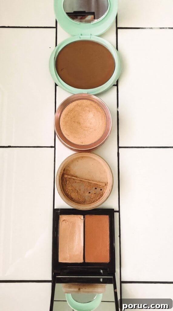 What Is Clean Beauty? 15 Top Clean-Beauty Brands to Try 5 bronzer, blush and highlighter sitting on white subway tile