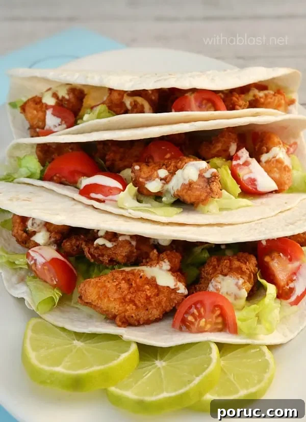 Close-up of chicken nugget tacos with lime dressing Chicken Nugget Tacos with Lime Dressing