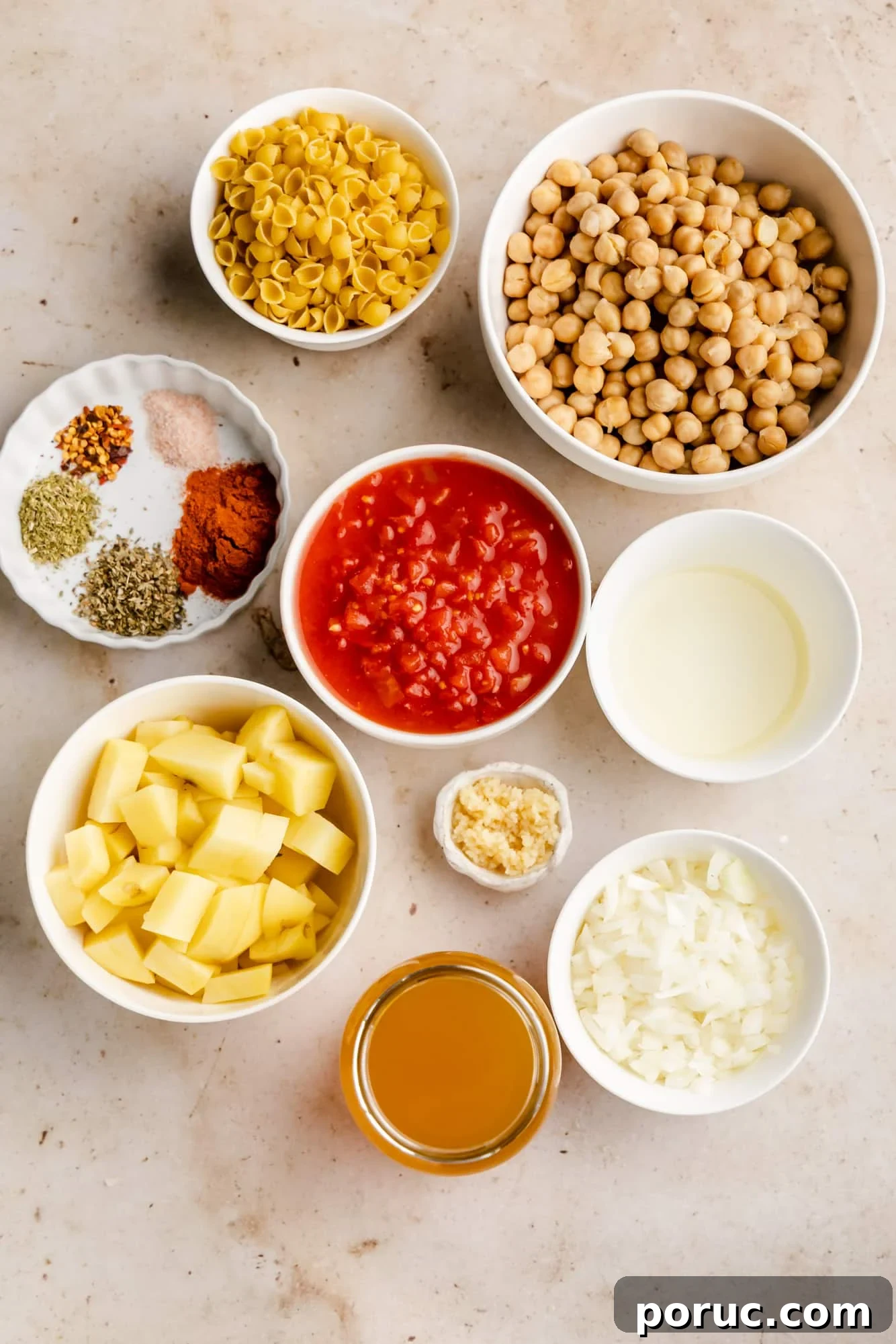 Hearty Italian Chickpea Soup Recipe for Comforting Weeknight Meals 4 ingredients for Italian chickpea soup in individual white bowls.