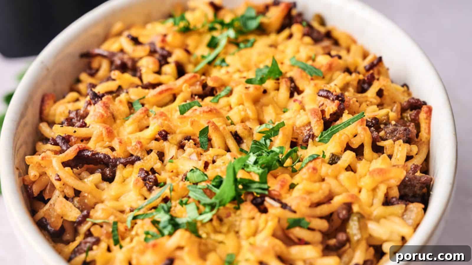 29 Air Fryer Casseroles Perfect for Busy Weeknight Dinners 23 A baked dish with pasta, ground beef, melted cheese, and topped with fresh parsley.