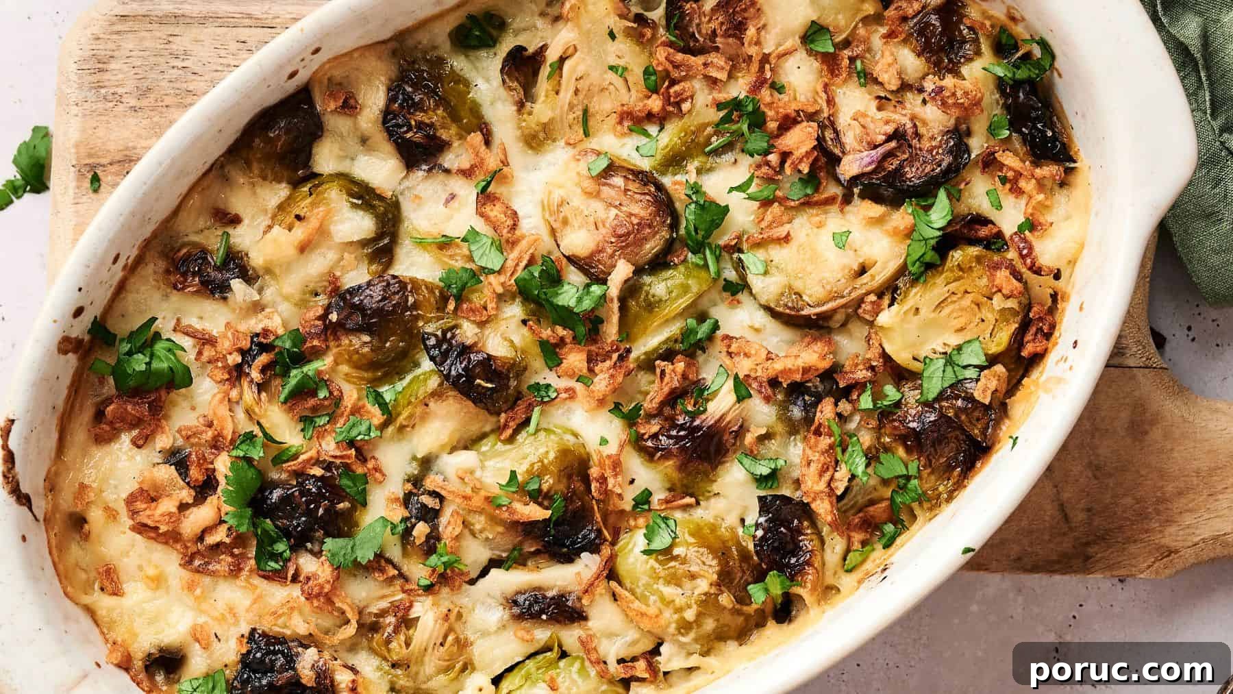 29 Air Fryer Casseroles Perfect for Busy Weeknight Dinners 28 A baked casserole dish filled with roasted Brussels sprouts, melted cheese, crispy onions, and chopped herbs on top.