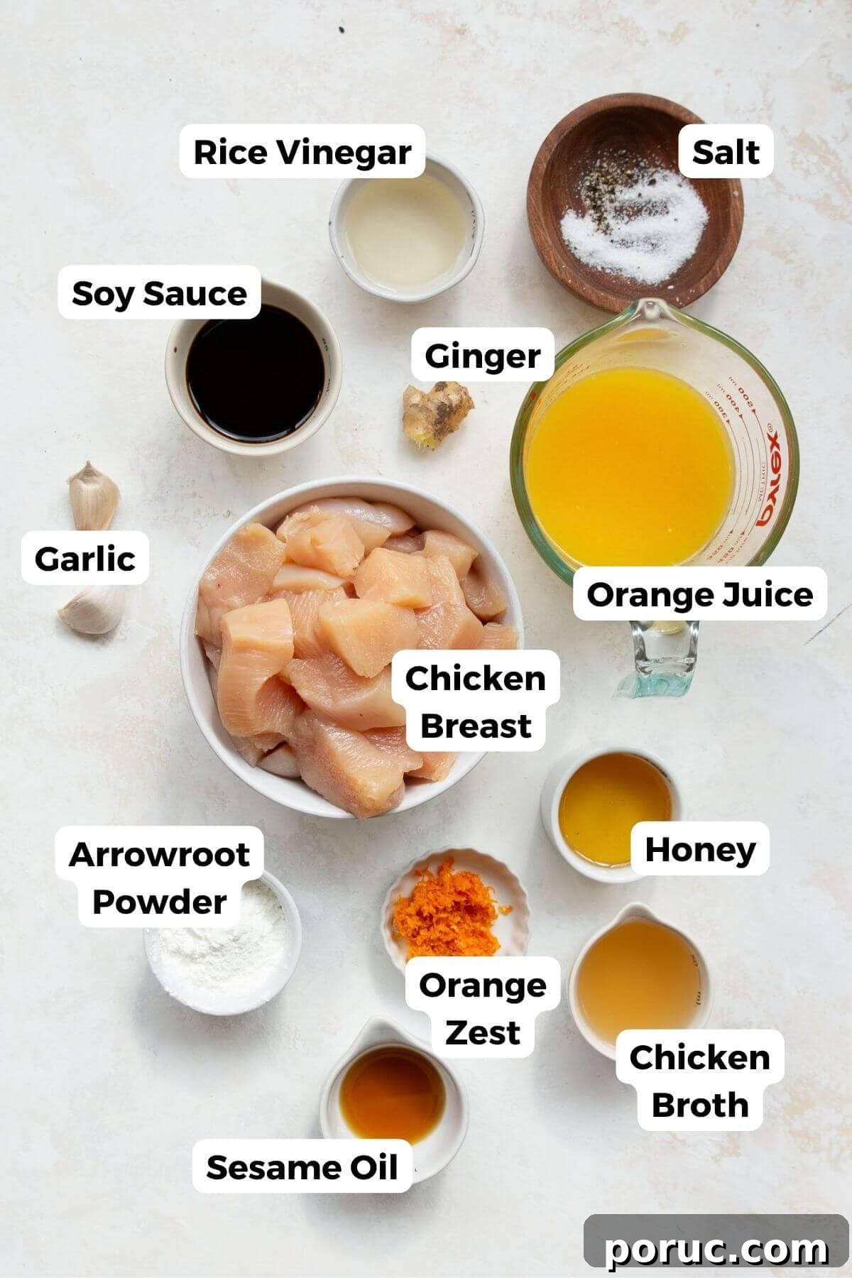 Crispy Air Fryer Orange Chicken Recipe You’ll Love 3 All the ingredients in air fryer orange chicken including raw chicken breast, oranges, honey, chicken broth, garlic, ginger, soy sauce, and arrowroot powder.
