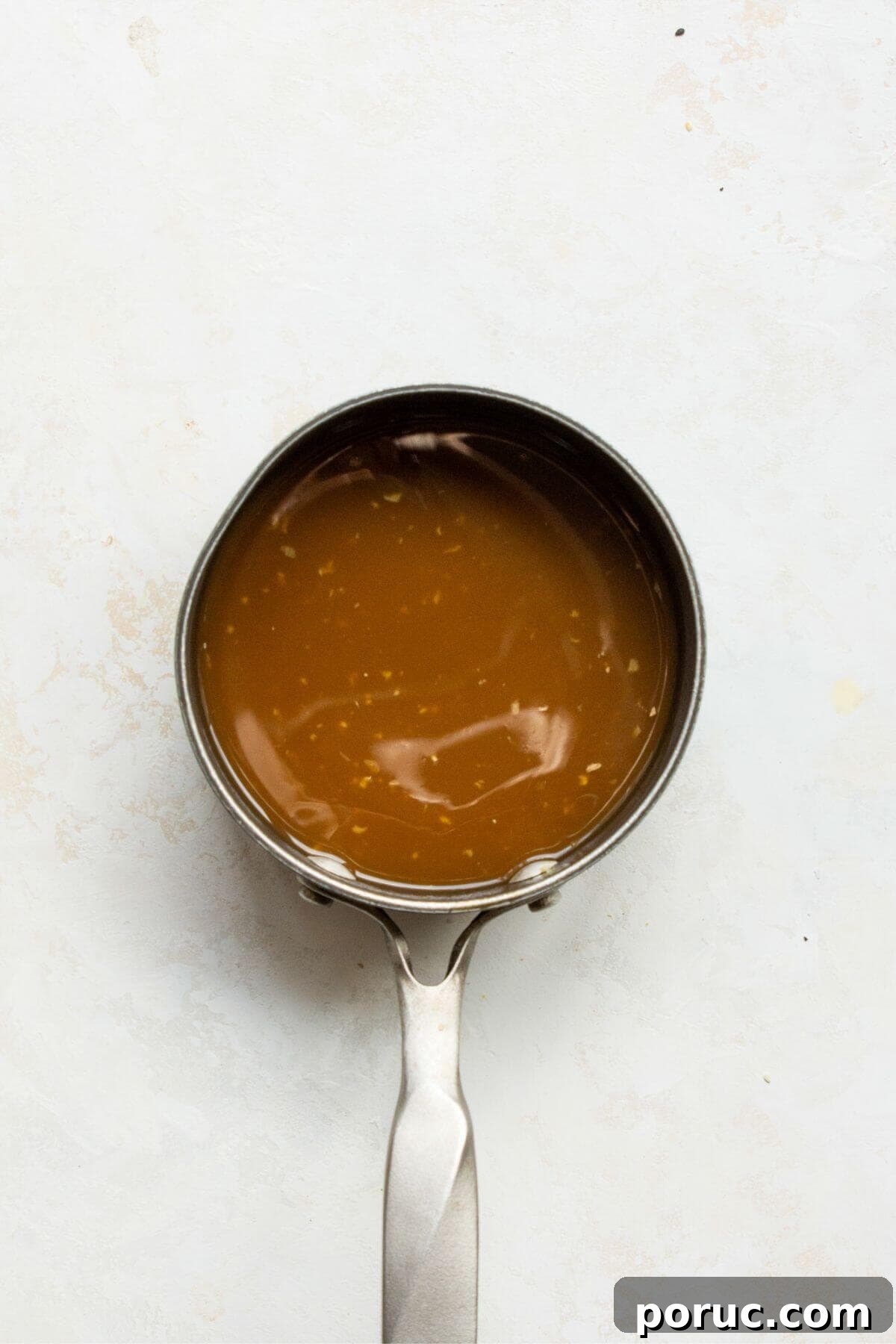 Crispy Air Fryer Orange Chicken Recipe You’ll Love 9 Adding chicken broth, fresh orange juice, soy sauce, and vinegar to the pot.