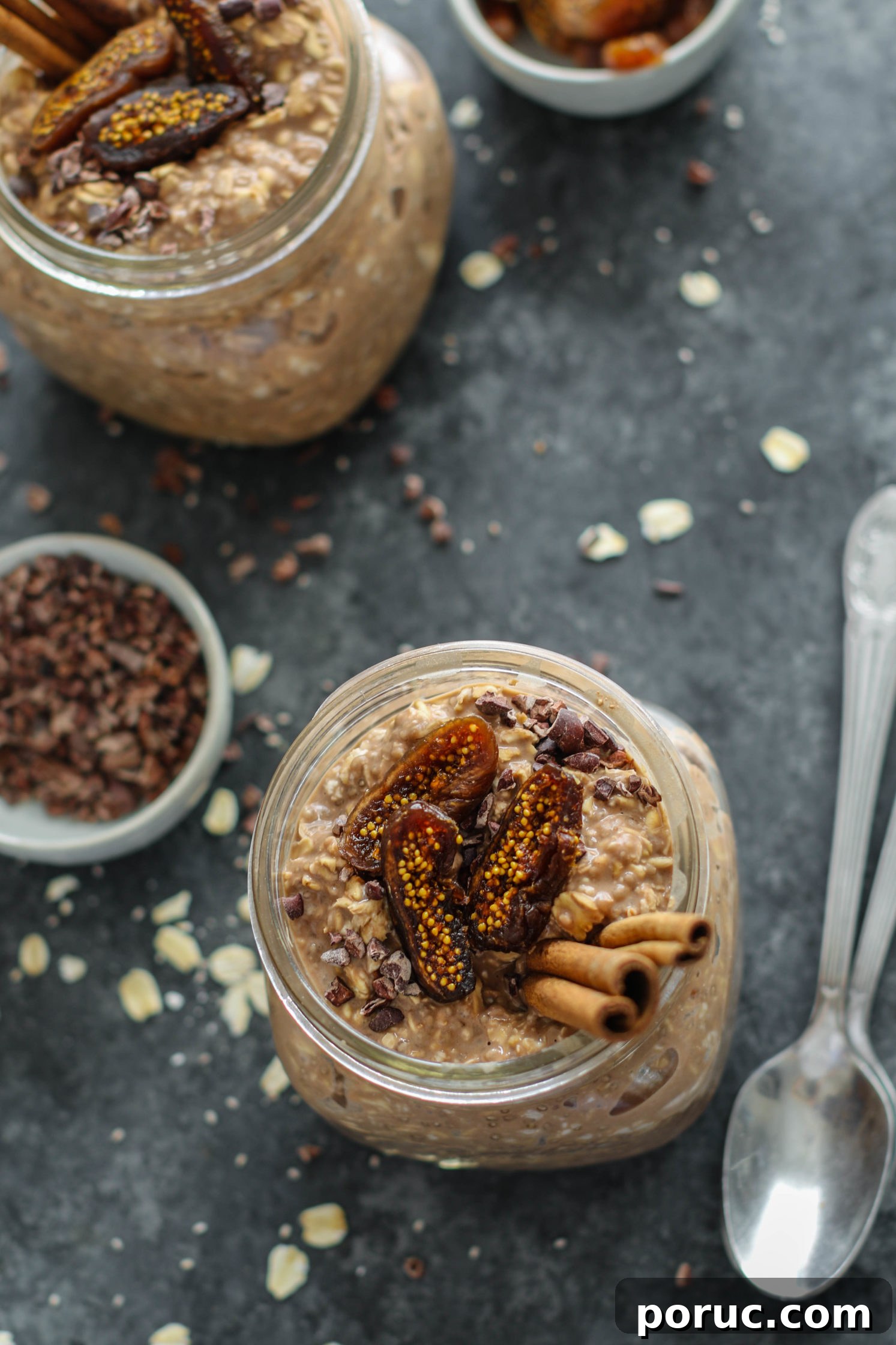 Chocolate Chia Chai Overnight Oats Recipe for Creamy Morning Energy 2 Chocolate Chia Chai Overnight Oats served in mason jars with dried figs, cacao nibs, and cinnamon sticks