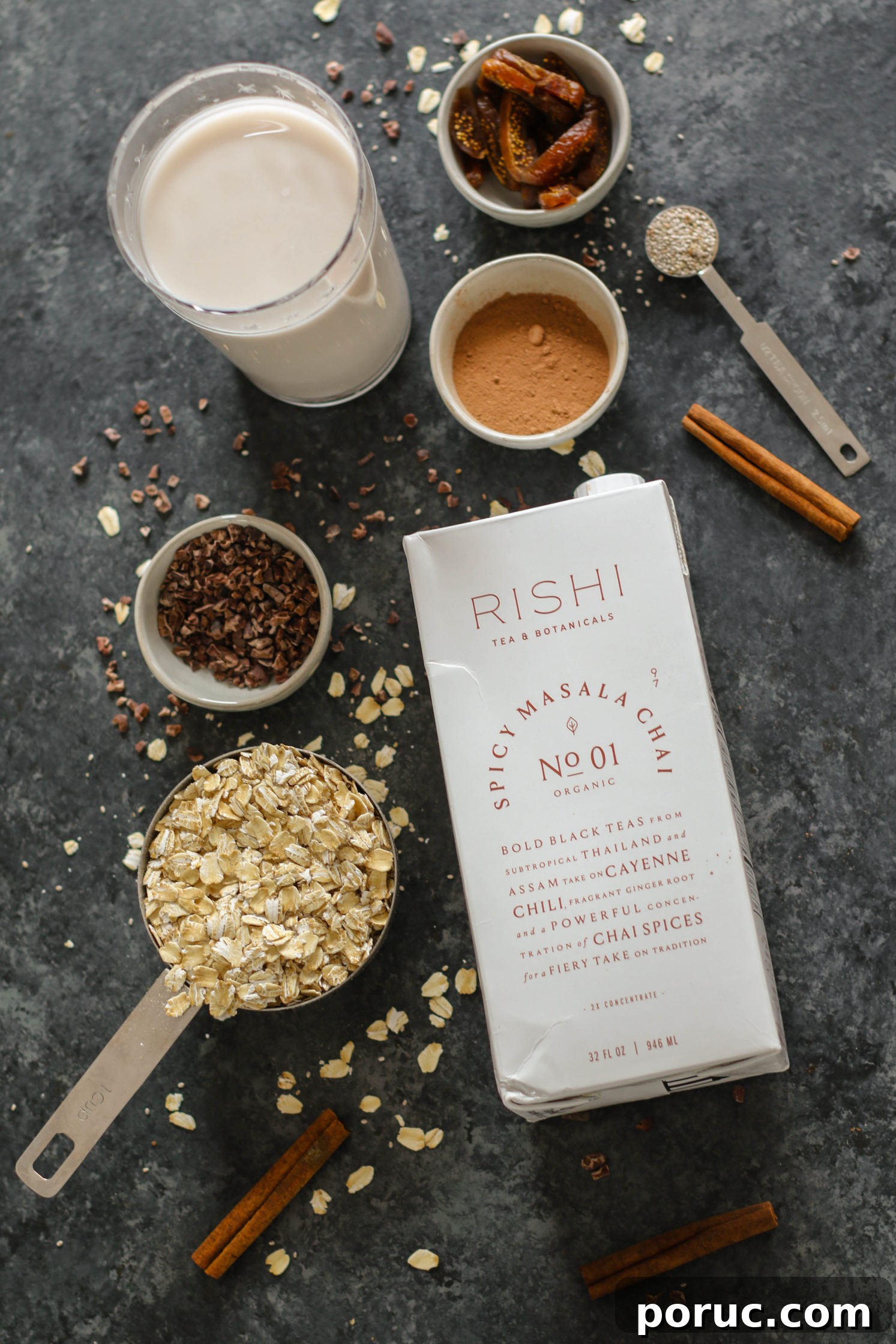 Chocolate Chia Chai Overnight Oats Recipe for Creamy Morning Energy 3 chocolate chai overnight oats ingredients on dark board