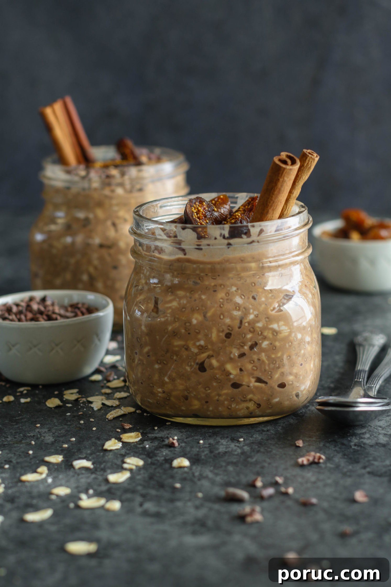 Chocolate Chia Chai Overnight Oats Recipe for Creamy Morning Energy 6 Chocolate Chia Chai Overnight Oats served in mason jars with dried figs, cacao nibs, and cinnamon sticks
