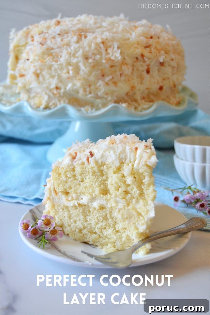 Ultimate Coconut Layer Cake Recipe for Moist, Classic Flavor 2 coconut layer cake slice on a white plate with flowers and a fork