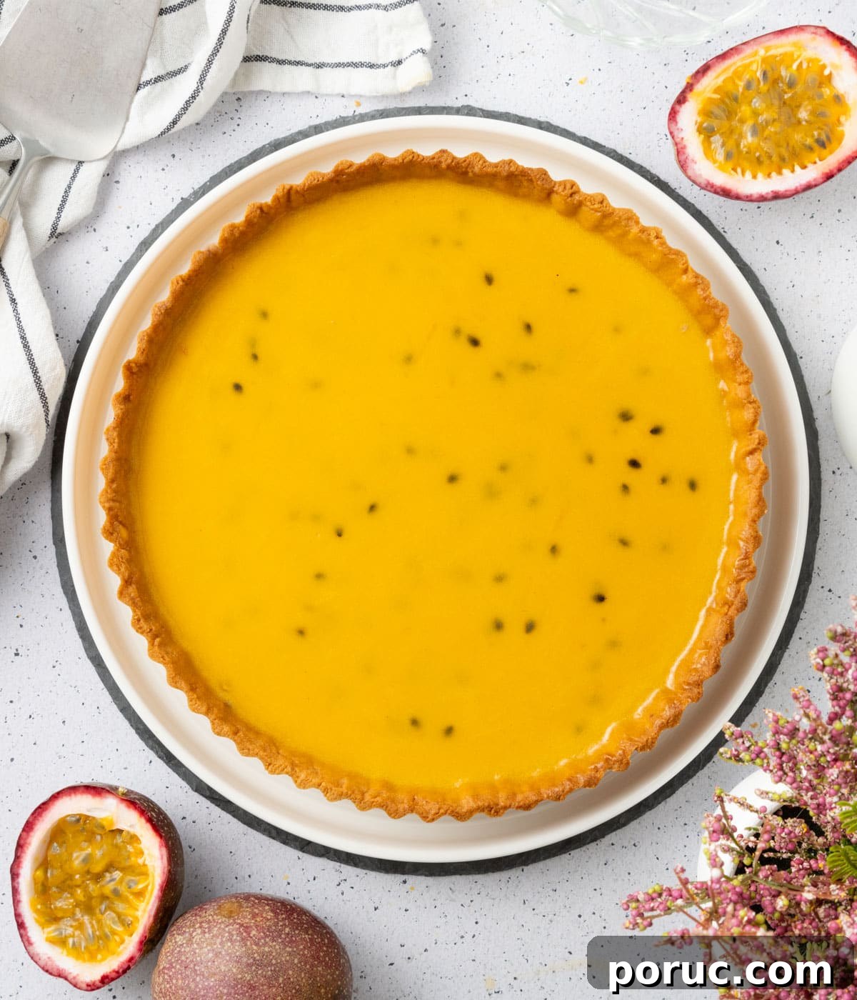 Set passion fruit filling inside the tart shell seen from above.
