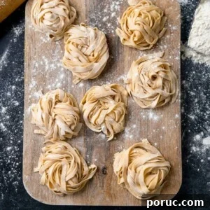 Little piles of homemade pasta on a wooden board