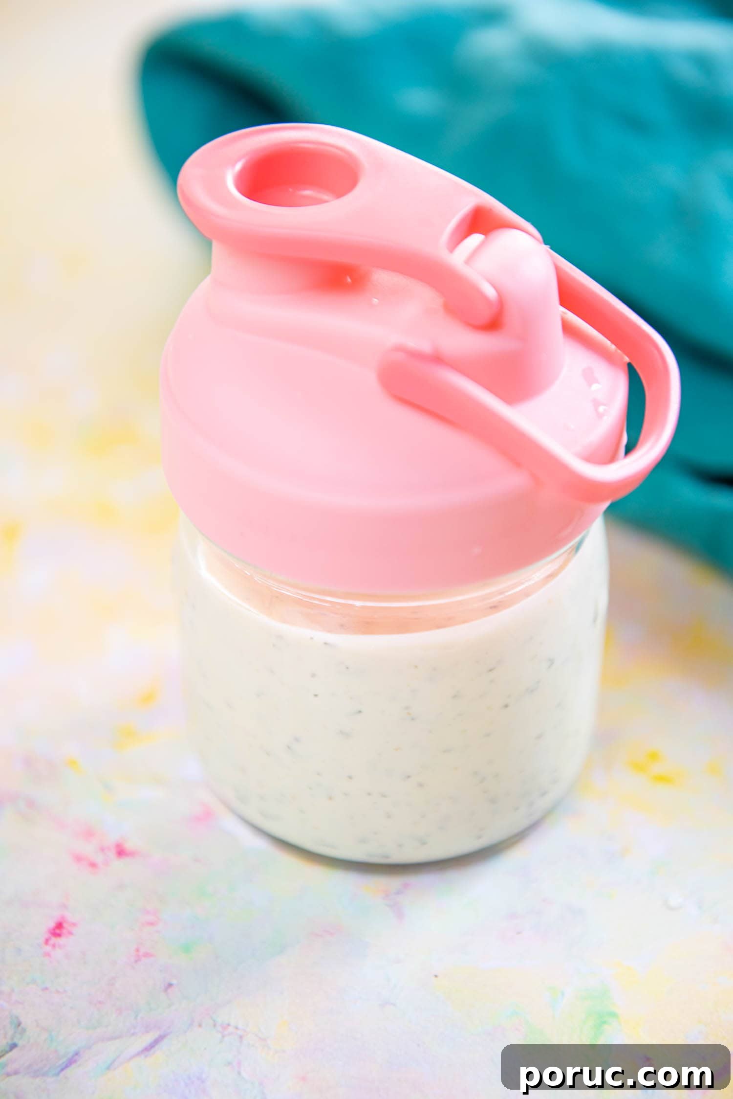 DIY Ranch Seasoning Mix Recipe – Quick Homemade Blend for Dip & Dressing 9 small mason jar with pink lid filled with homemade ranch dressing