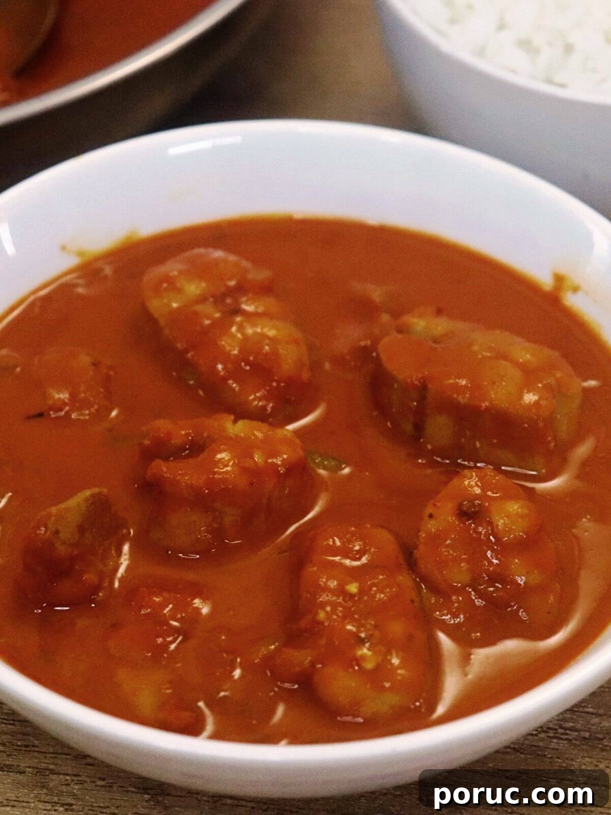 Goan Ambot Tik (Moriche Ambotik) Recipe: Tangy Spicy Fish Curry 2 ambotik made with shark fish served in a white bowl.