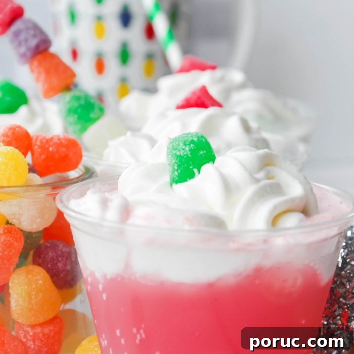 Gumdrops & Sherbet Party Punch Recipe 7 close up of a gum drop punch in plastic cup on table