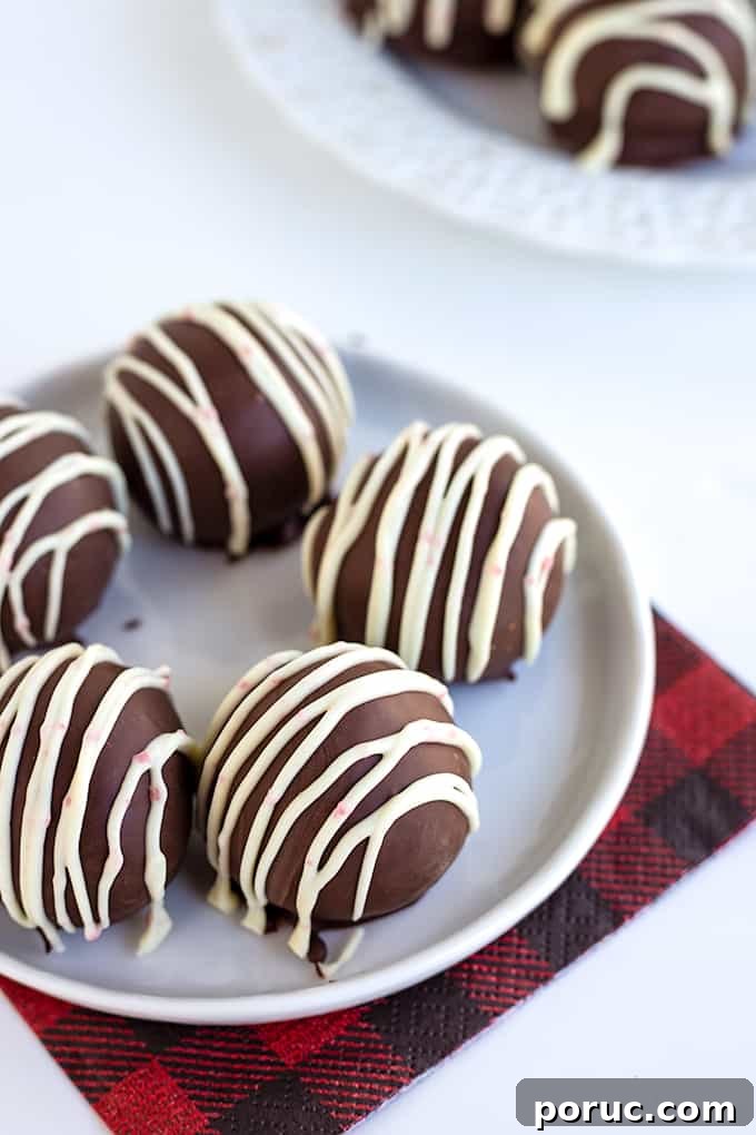 Oreo cookie balls on a buffalo plaid napkin on a white surface