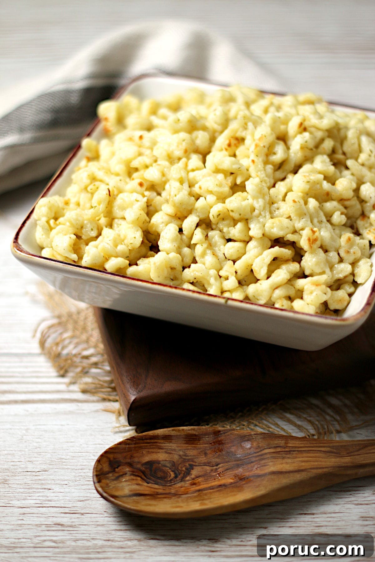 Authentic German Spaetzle Recipe: Step-by-Step Homemade Spaetzle 3 Homemade Spaetzle in a square bowl.