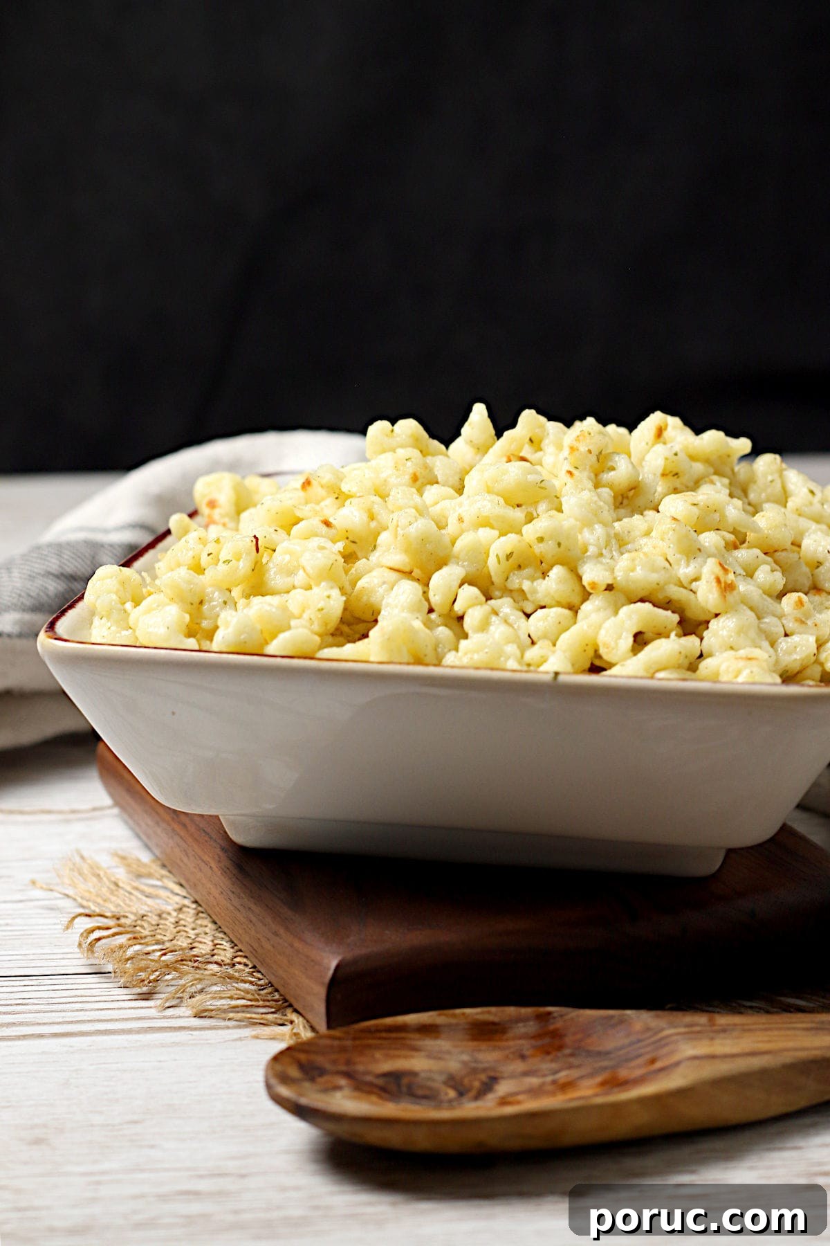 Authentic German Spaetzle Recipe: Step-by-Step Homemade Spaetzle 4 Homemade Spaetzle in a square bowl.