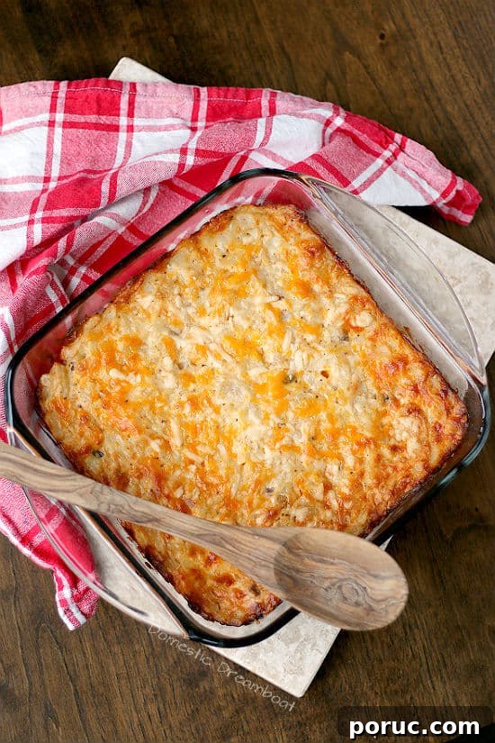 Authentic German Spaetzle Recipe: Step-by-Step Homemade Spaetzle 8 Overhead photo of cheesy hashbrown casserole in a glass baking dish.