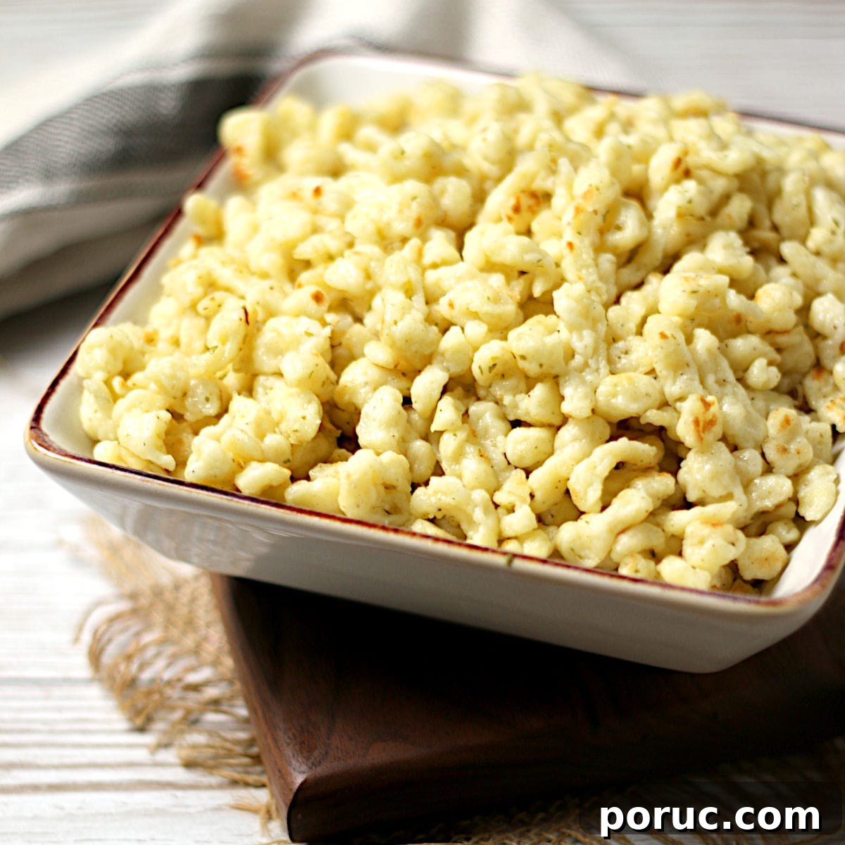 Authentic German Spaetzle Recipe: Step-by-Step Homemade Spaetzle 9 Homemade Spaetzle in a square bowl.
