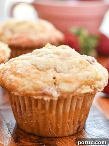 Delicious bakery-style strawberry muffins with a golden crumb and fresh strawberry flavor. Perfect f.