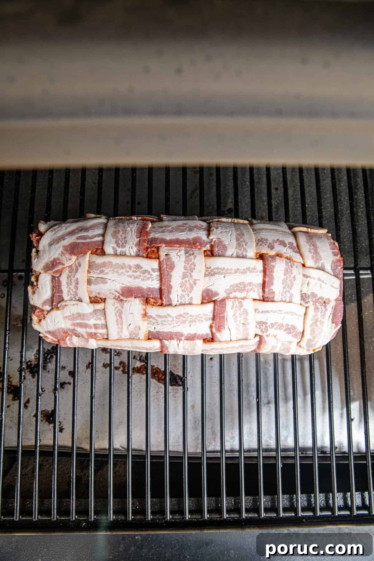 Ultimate Bacon Explosion Recipe: Stuffed Bacon-Wrapped Meatloaf 11 Bacon Explosion stuffed and weaved roll on grill