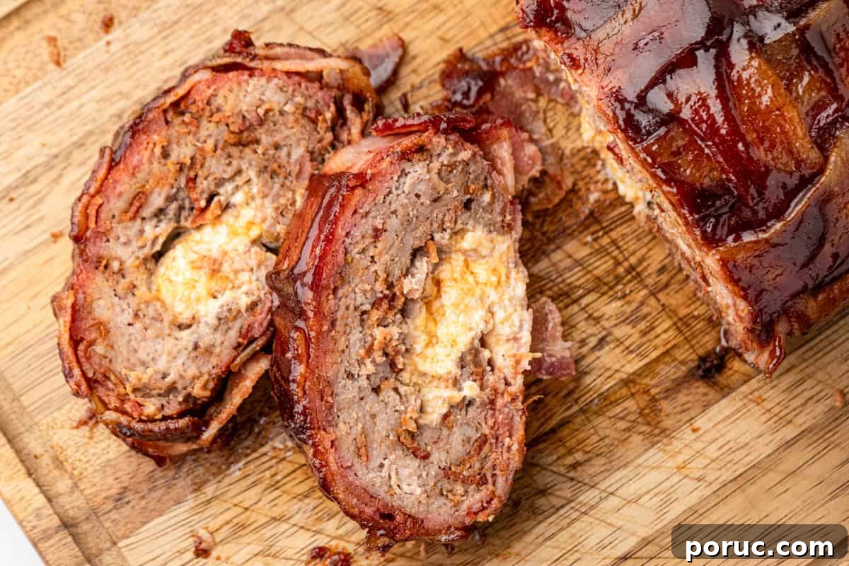 Ultimate Bacon Explosion Recipe: Stuffed Bacon-Wrapped Meatloaf 16 Bacon Explosion sliced on wooden cutting board