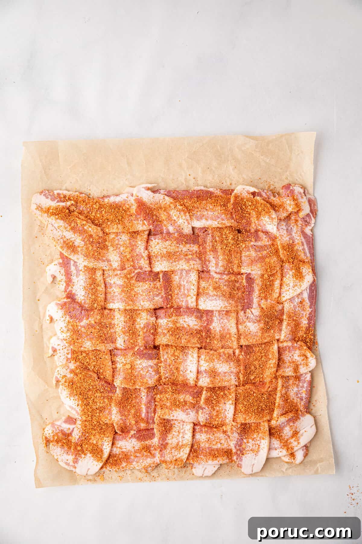 Ultimate Bacon Explosion Recipe: Stuffed Bacon-Wrapped Meatloaf 5 Adding seasoning to bacon weave for Bacon Explosion recipe