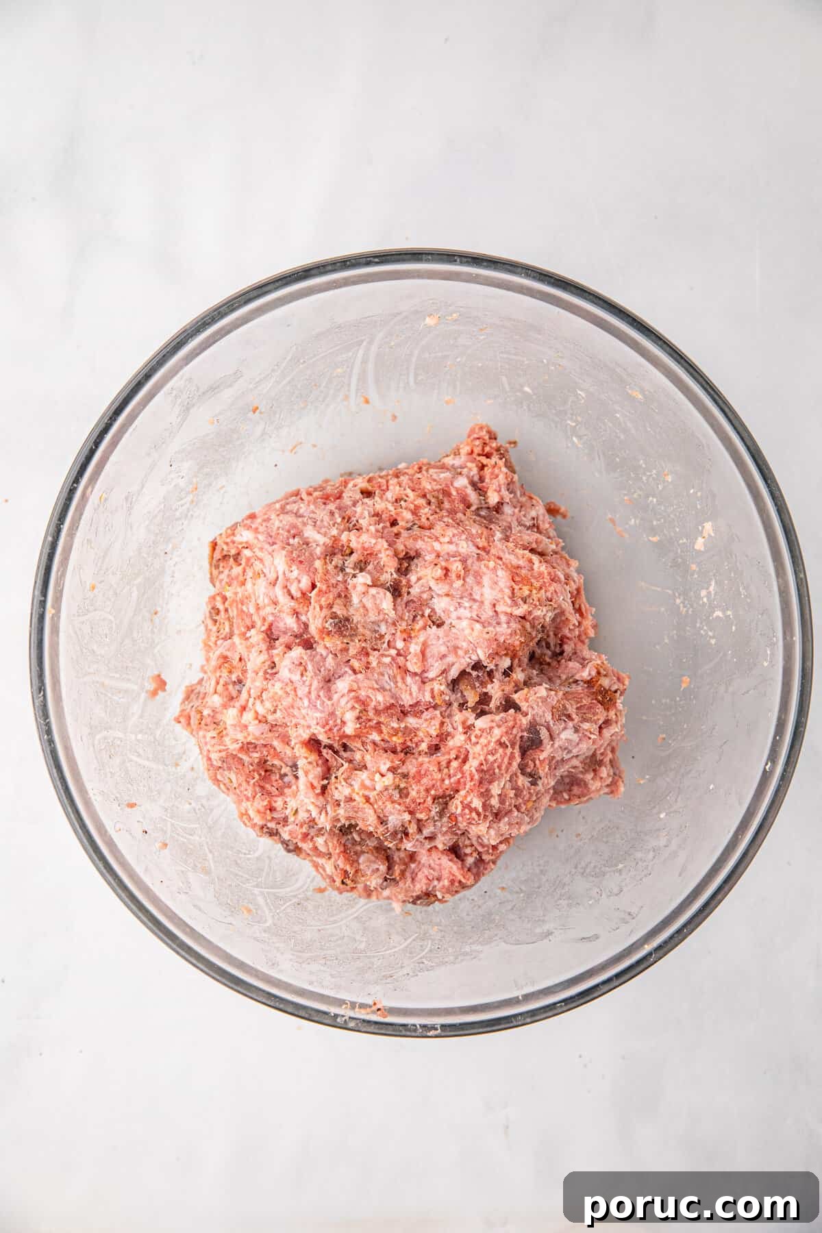 Ultimate Bacon Explosion Recipe: Stuffed Bacon-Wrapped Meatloaf 6 Ground pork and pork sausage in mixing bowl for Bacon Explosion recipe