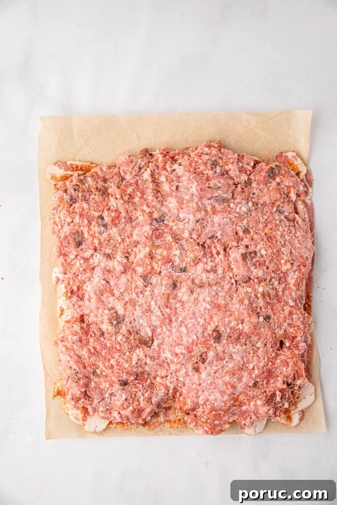 Ultimate Bacon Explosion Recipe: Stuffed Bacon-Wrapped Meatloaf 7 Spreading pork mixture over seasoned bacon weave for Bacon Explosion recipe