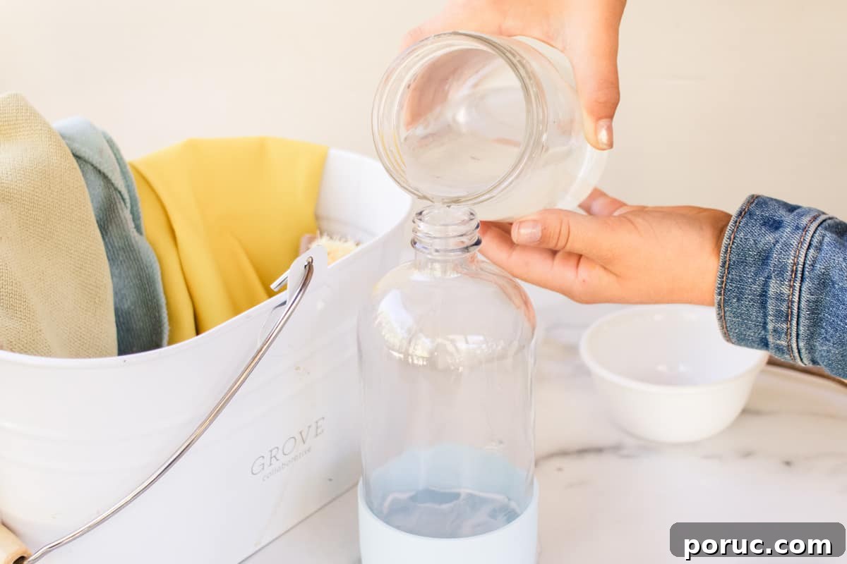 Remove Mold from Shower Grout Fast: Proven Step-by-Step Method 4 Pouring the liquid into a spray bottle.