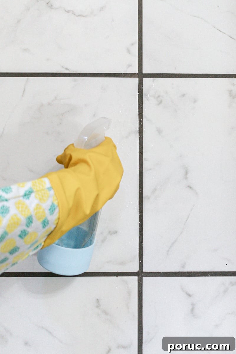 Remove Mold from Shower Grout Fast: Proven Step-by-Step Method 6 Spraying the mold spray onto the tile grout and letting it sit for several minutes.