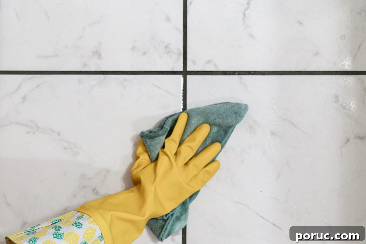 Remove Mold from Shower Grout Fast: Proven Step-by-Step Method 8 Wiping the surface clean with an old rag.
