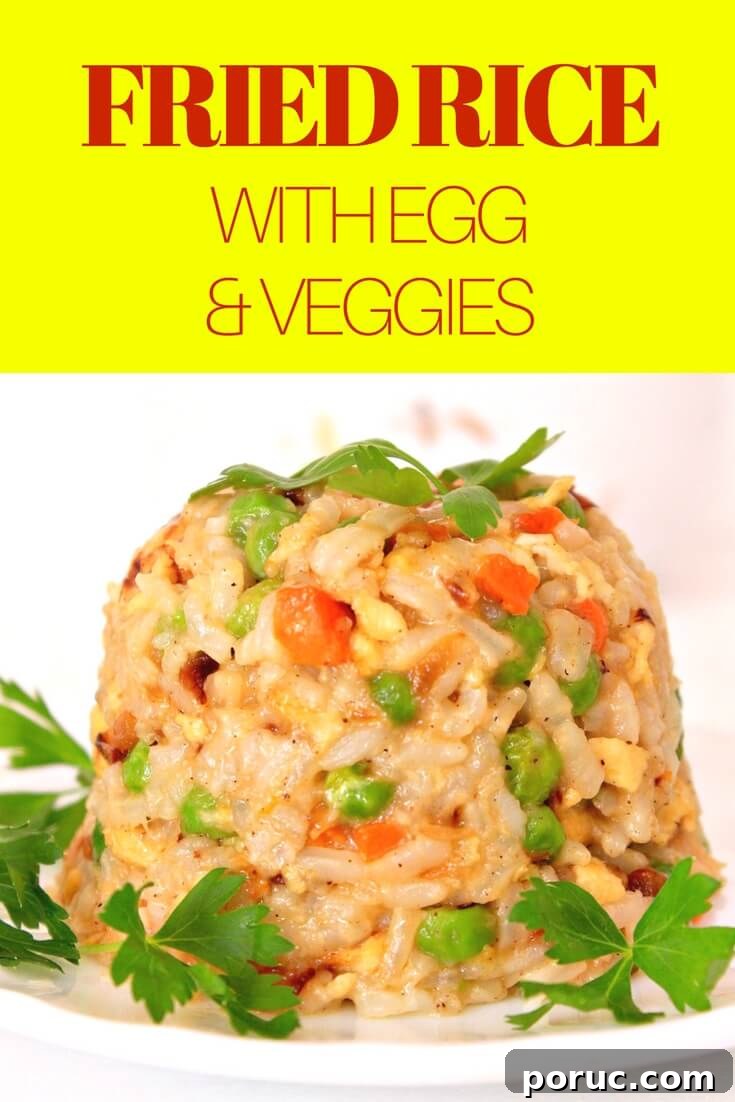 Image of easy egg fried rice with vegetables, on a white plate