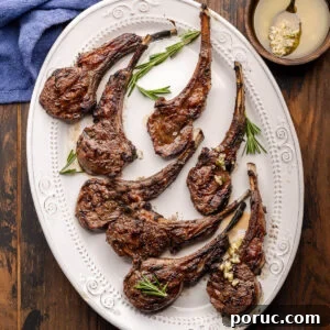 Lemon Garlic Grilled Lamb Rib Chops Recipe for Juicy Flavor 8 Grilled lamb rib chops on white platter for featured image.