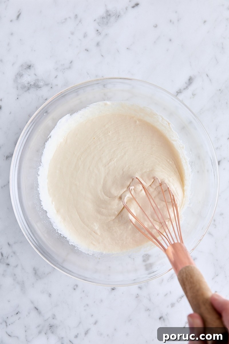 Wet ingredients whisked together in glass bowl