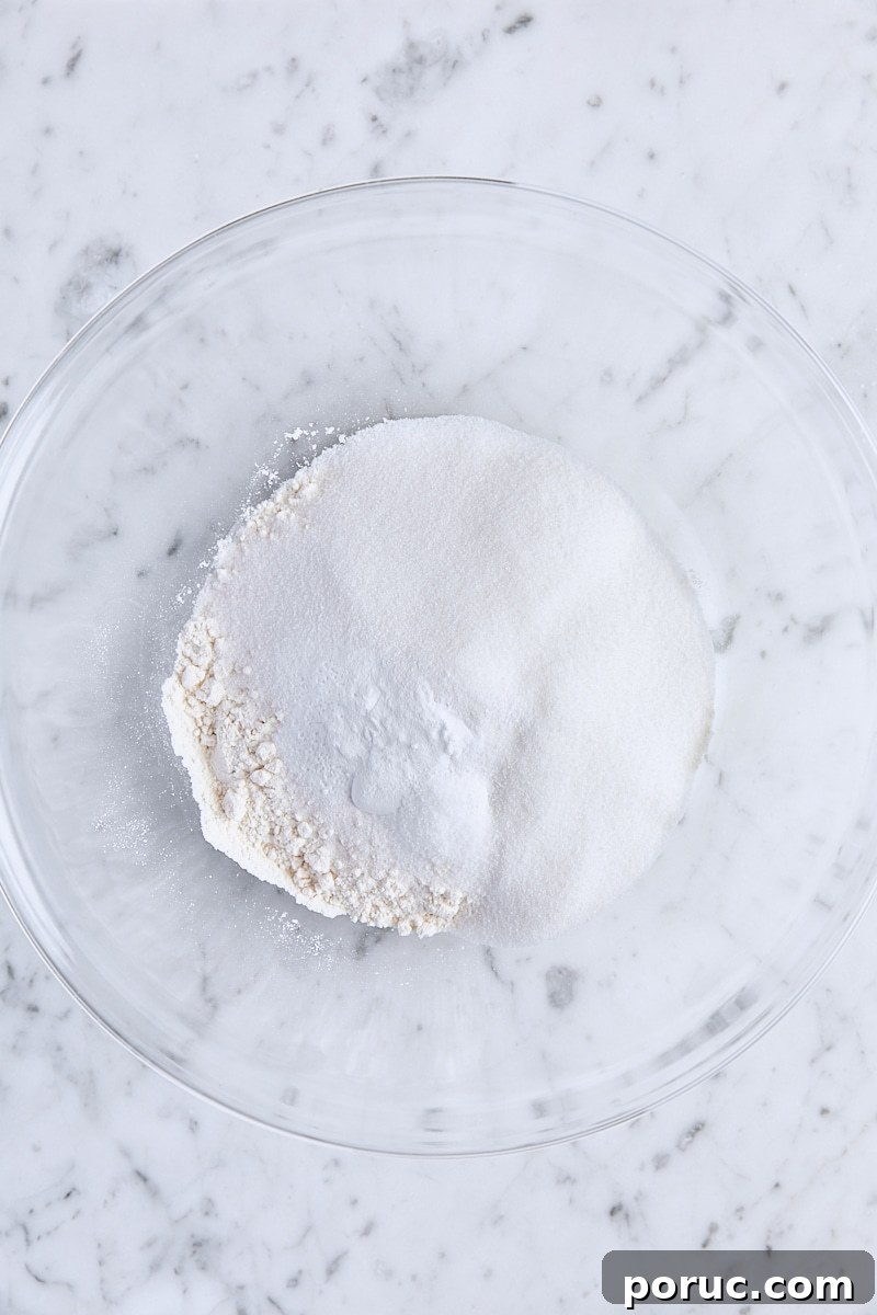 Flour, sugar, baking powder, baking soda, and salt in a large bowl