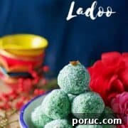 Paan Coconut Ladoo Recipe: How to Make Minty Indian Sweets 7 ladoos stacked on each other sitting on a blue rim bowl
