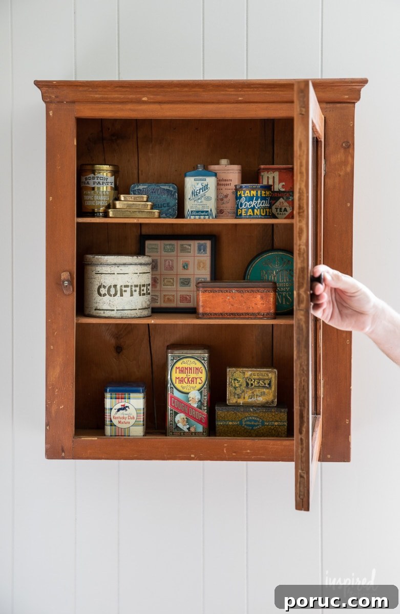 Hidden Vintage Treasures: My Latest Retro Finds and Collectibles 14 Collection of vintage metal tins in cabinet