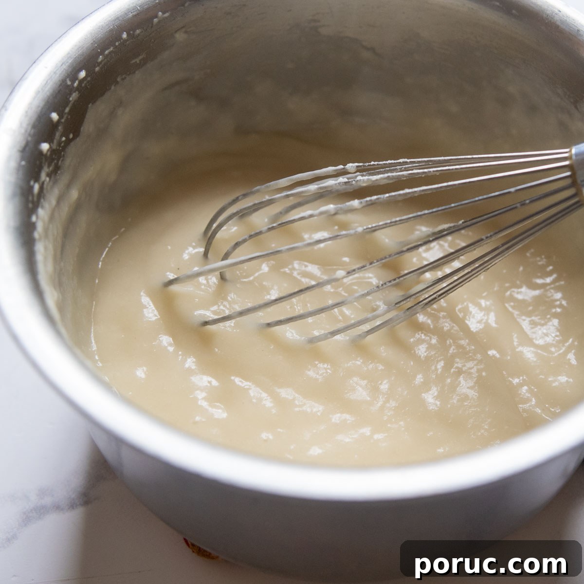 Velvety Gluten-Free Gravy Without Pan Drippings — Thickener Tips 5 the gravy starting to loosen and thicken.