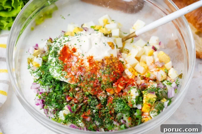 Homemade egg salad ingredients in a bowl.