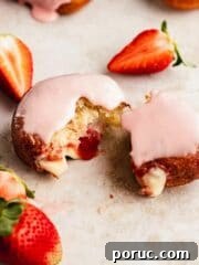 torn apart strawberry and custard filled donut