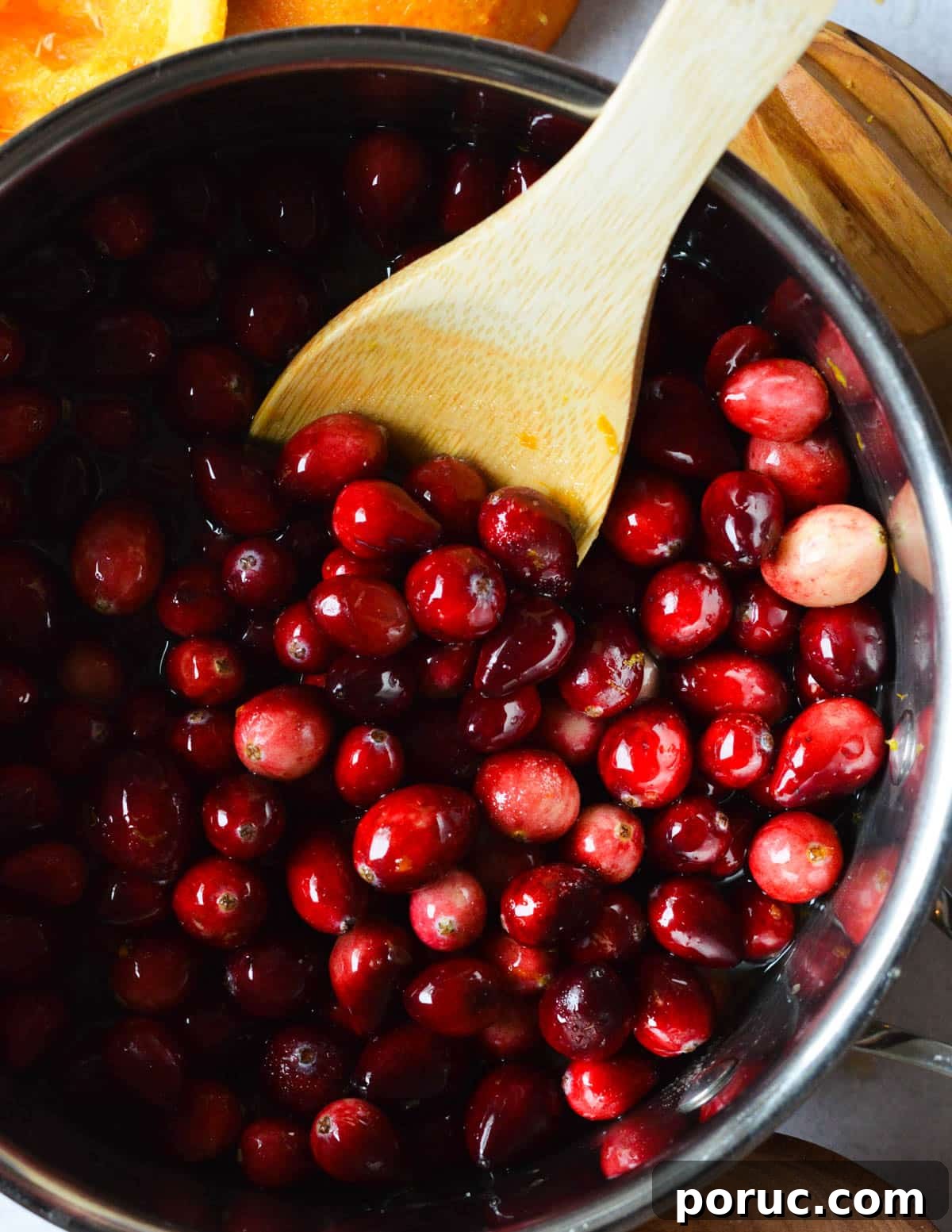 a pan with cranberries in apple cider. 