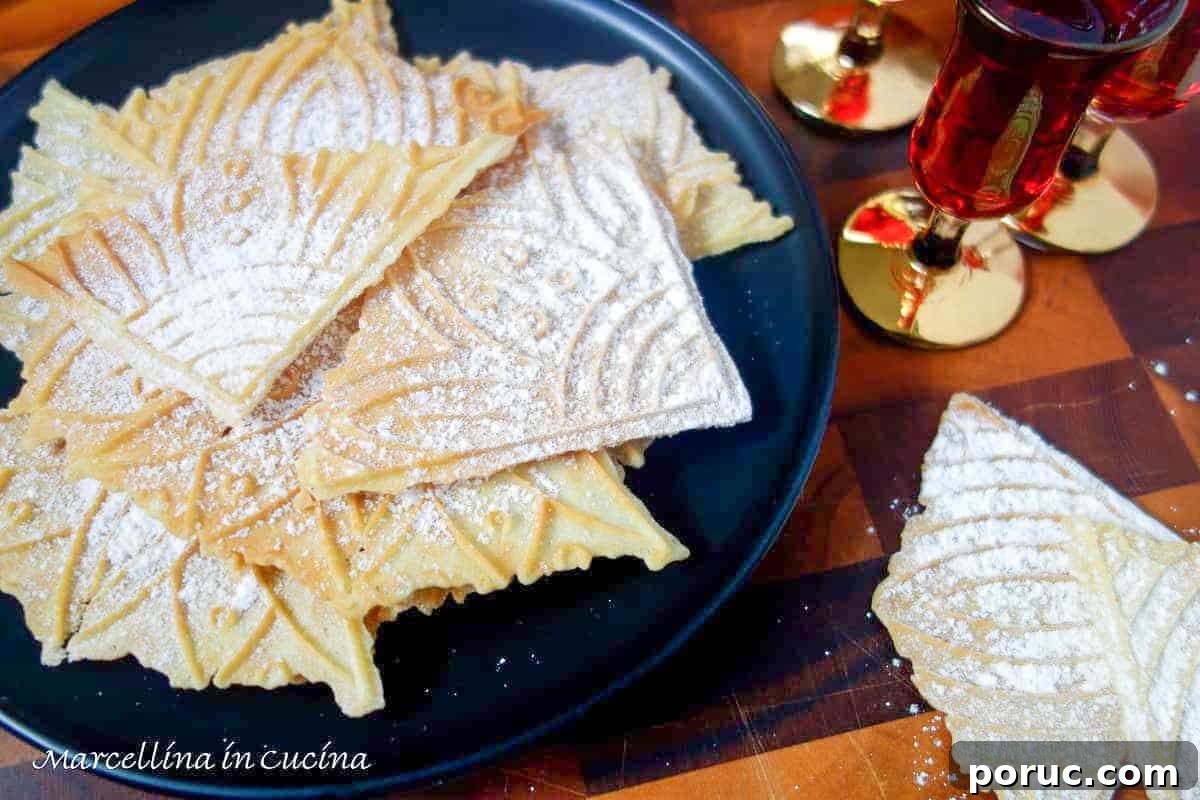 Crisp Lemon Pizzelle Cookies Recipe – Light Citrus Italian Wafers 5 wafer cookies on black plate