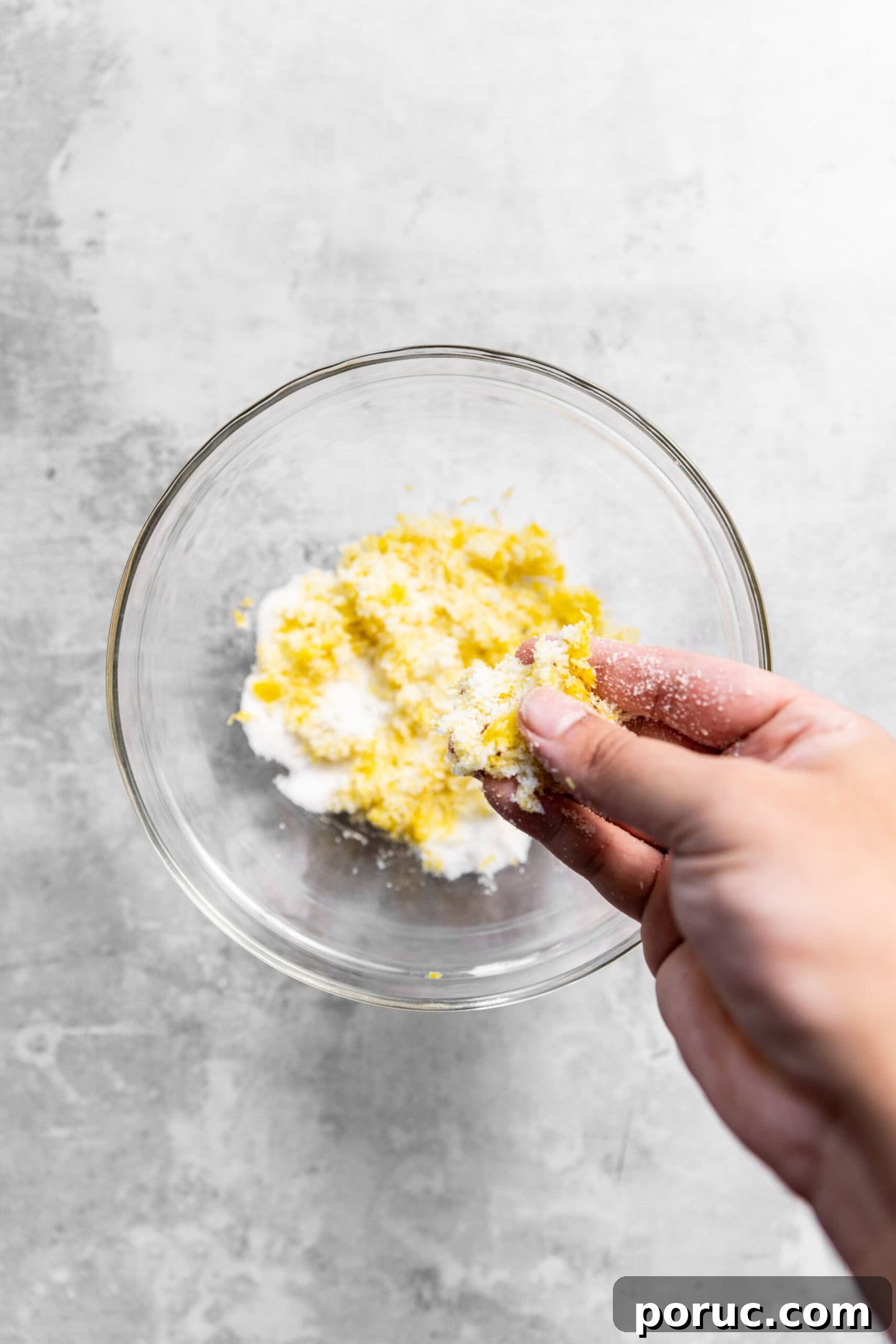 Elegant Lemon Sugar Cookies with Minimal Effort 4 Lemon zest being rubbed into sugar to release oils
